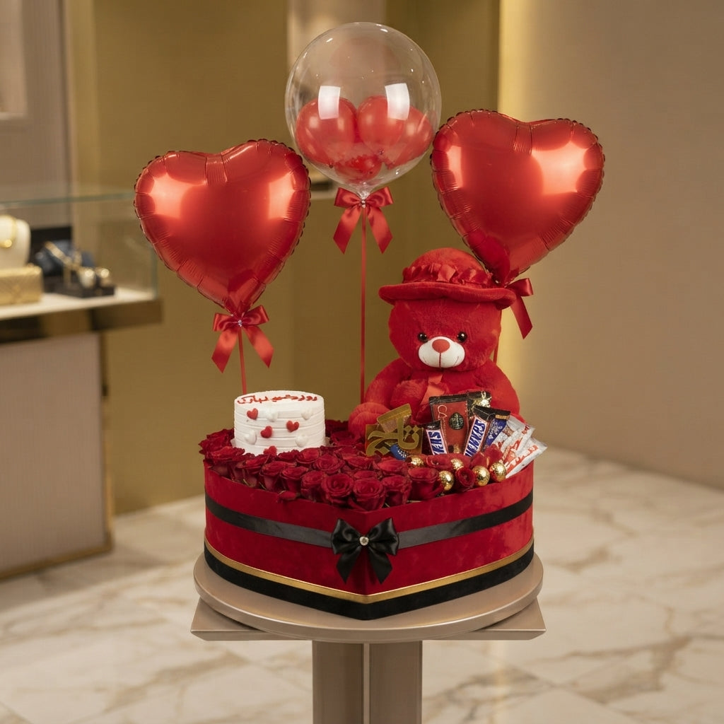 Red and white flower and chocolate gift box arrangement
