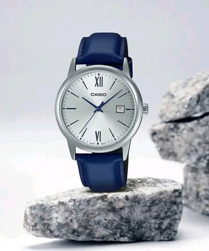 Gold-tone round watch with black dial and black leather strap