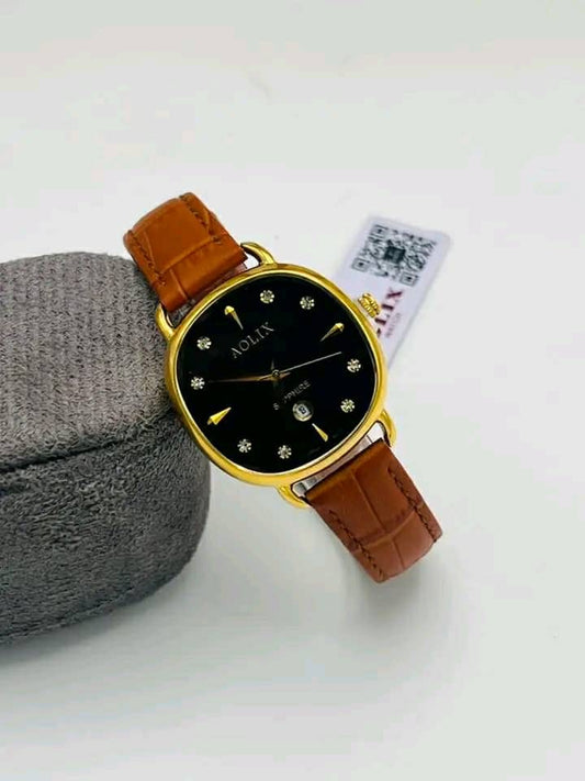 Gold-tone round watch with black dial and brown leather strap